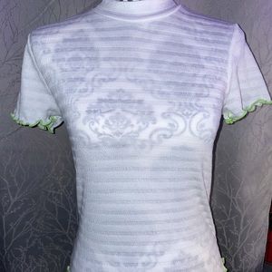 White shirt with green ruffles